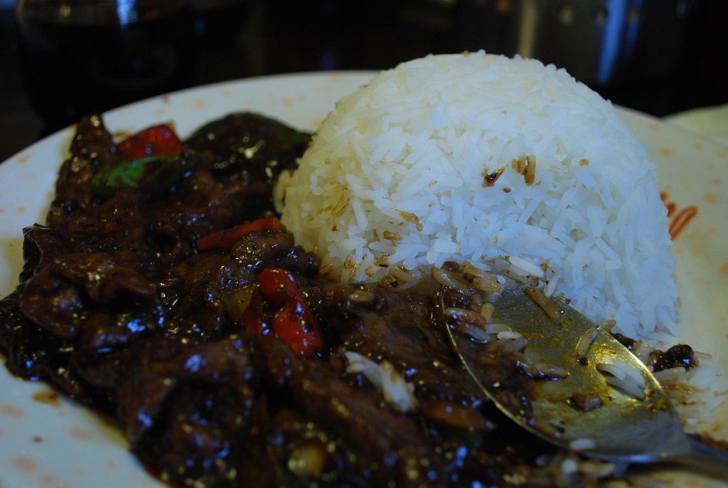 Chef seasoning a wok